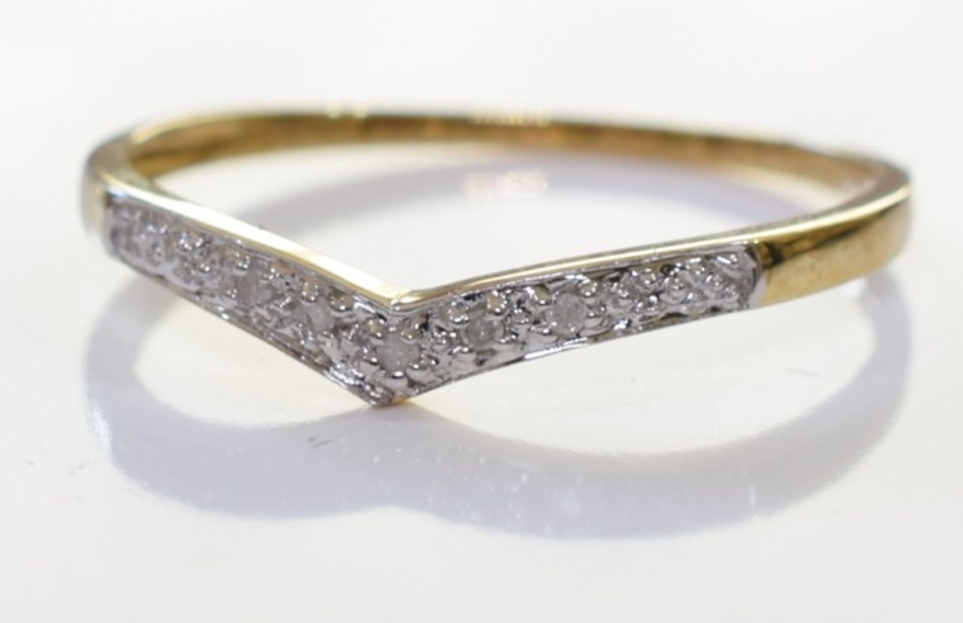 A 9ct Gold chevron style diamond ring.