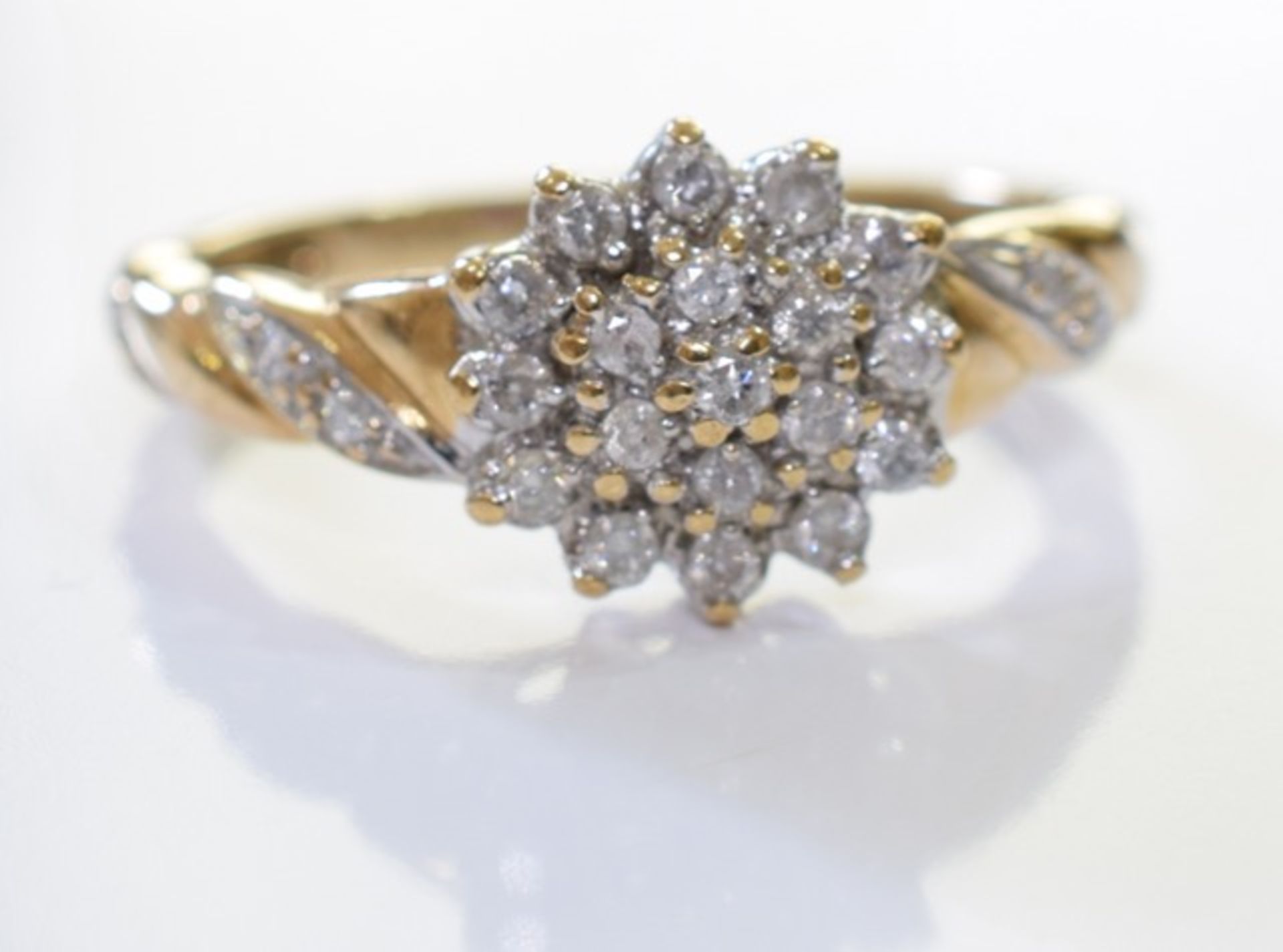 A 9ct Gold Diamond cluster ring.