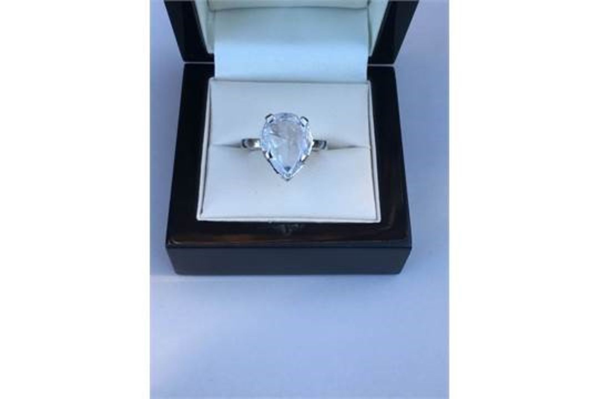 6.04 ct Pear-cut Diamond Solitaire Ring set in 18k White Gold band.