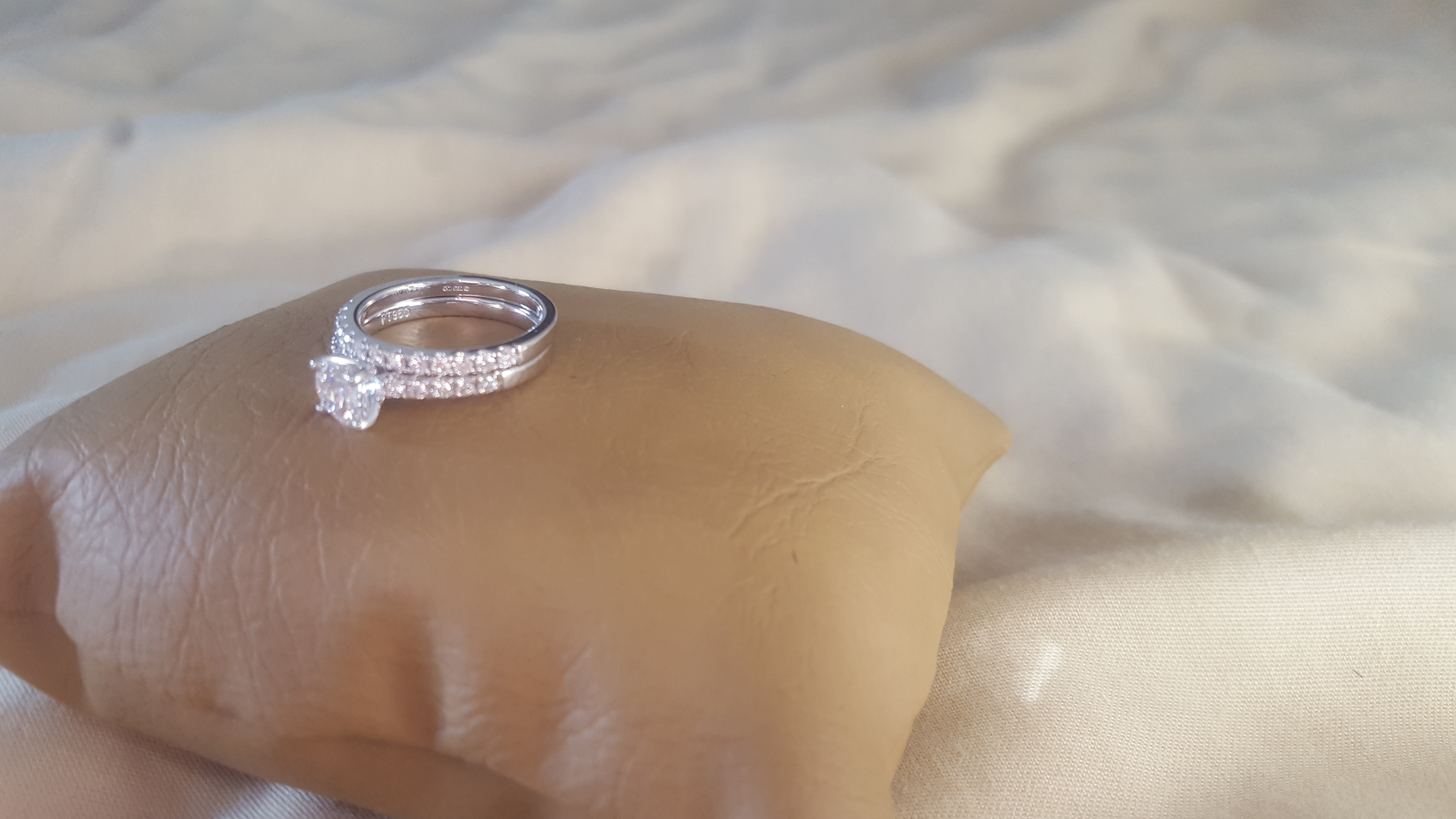 Flawless princess cut, platinum design novo set, diamond engagement ring with matching band.