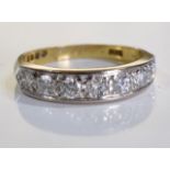 An 18ct gold diamond rings. A row of brilliant-cut diamond half-circle eternity ring. 0.4 carats -