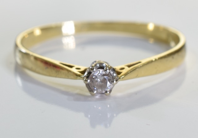 An 18ct gold diamond solitaire ring, A 0.1carat single brilliant cut diamond set in 18ct gold. 1.