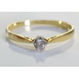 An 18ct gold diamond solitaire ring, A 0.1carat single brilliant cut diamond set in 18ct gold. 1.