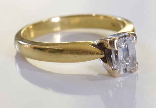 A 18ct Gold Emerald cut diamond ring. Size J. The diamond is of very good quality, clear without - Image 4 of 5