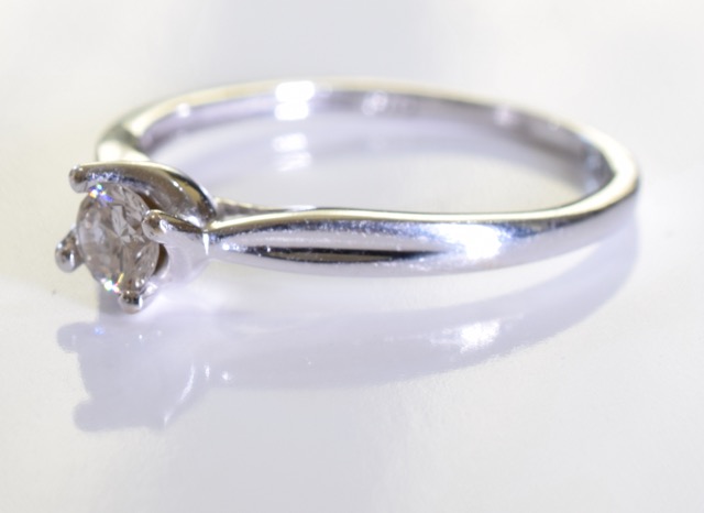 A 9ct gold white gold solitaire ring. A brilliant cut single round diamond set in 9ct white gold. - Image 2 of 4