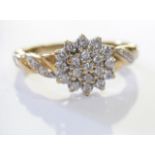 A 9ct gold diamond cluster ring. To include a brilliant-cut diamond cluster ring with diamond