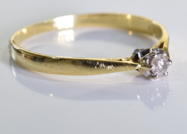 An 18ct gold diamond solitaire ring, A 0.1carat single brilliant cut diamond set in 18ct gold. 1. - Image 3 of 3