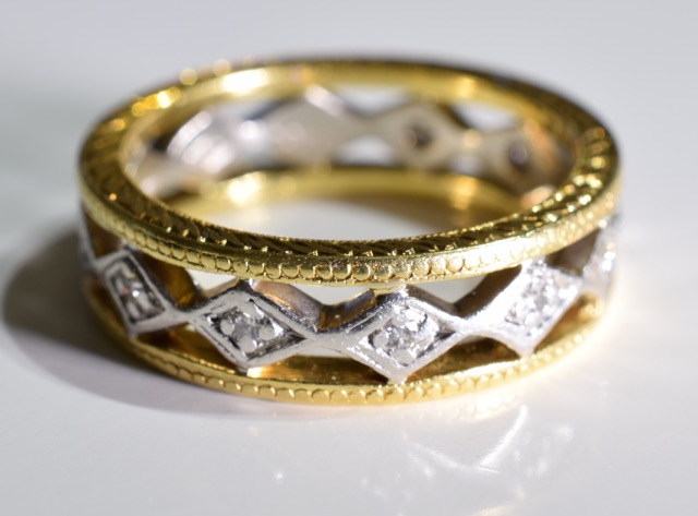 A 18CT Gold diamond full-circle eternity ring. Of bi-colour openwork design, the brilliant-cut - Image 3 of 3