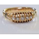 An early 20th century 18ct gold five-stone ring. Designed as a graduated circular-cut diamond