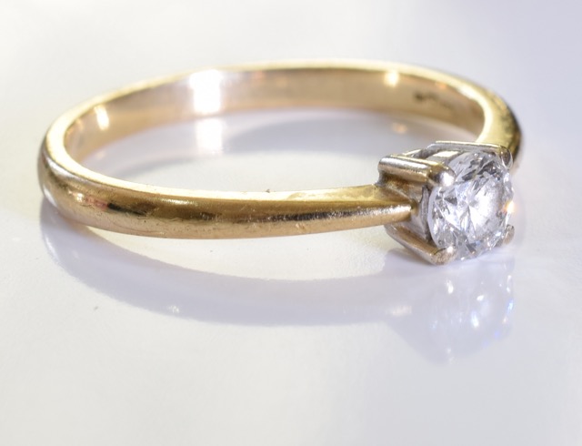 A 9 ct gold solitaire ring. A 0.25ct brilliant cut diamond set in 9ct gold. 1.7grms - size K - Image 2 of 3