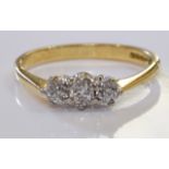 A 18ct gold diamond three-stone ring. With three graduated old cut diamonds. Estimated total diamond