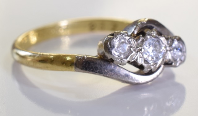 An 18ct Gold and Diamond Crossover ring, Three brilliant cut round graduated diamonds set in a - Image 2 of 2