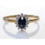 A 9ct gold and sapphire diamond ring. 1.6grms - size M.