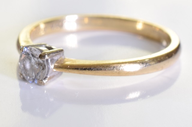 A 9 ct gold solitaire ring. A 0.25ct brilliant cut diamond set in 9ct gold. 1.7grms - size K - Image 3 of 3