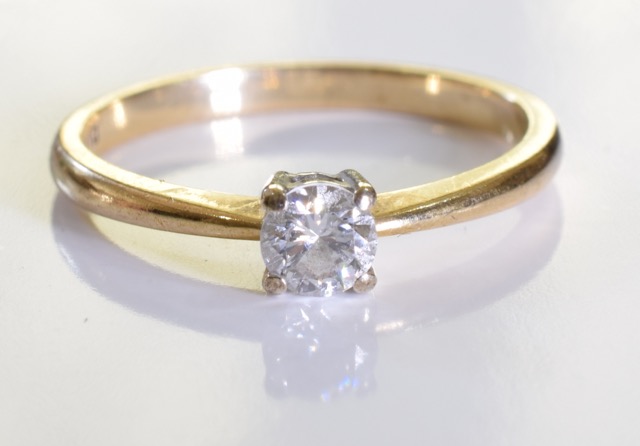 A 9 ct gold solitaire ring. A 0.25ct brilliant cut diamond set in 9ct gold. 1.7grms - size K