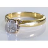 A 18ct Gold Emerald cut diamond ring. Size J. The diamond is of very good quality, clear without