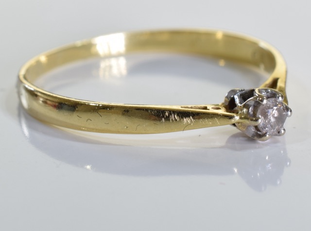 An 18ct gold diamond solitaire ring, A 0.1carat single brilliant cut diamond set in 18ct gold. 1. - Image 2 of 3