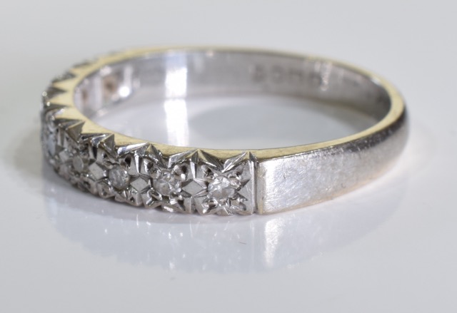 An 18ct white gold diamond ring. A half eternity ring set with brilliant cut diamonds in an 18ct - Image 4 of 4