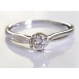 A 9ct gold white gold solitaire ring. A brilliant cut single round diamond set in 9ct white gold.