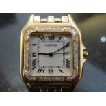 18ct Yellow Gold Cartier Panther watch with diamond bezel. Case size measure 27mm without crown.