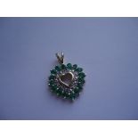 Emerald heart:Say I love you with this adorable pendant in 10k yellow gold with 0.12ct diamonds