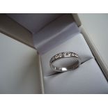 This BIRKS wedding band features 13 diamonds with a total carat weight of 0.65ct, with a colour