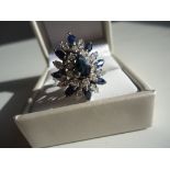 Show stopping cocktail ring: This pear shaped blue sapphire is surrounded by 26 brilliant round