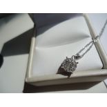Classic and always in style; A dazzling diamond cluster pendant set in 14K white gold on a