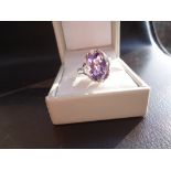 Cocktail ring in 10K white gold with an extra large amethyst surrounded by high grade cubic zirconia