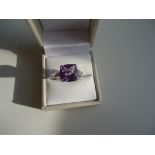 10k white gold ring with a genuine Cushion cut very large Amethyst and high grade cubic Zirconia.