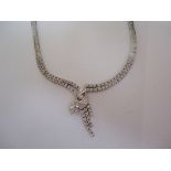 Incredible tennis style necklace with an intricate front detail. This beautiful piece boast 102