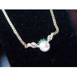 Classic Italian 15 inch necklace in 18k yellow gold with a large fresh water pearl in the center,