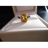 Dainty ring in 10K white gold with an oval cut citrine.signed. '10K'O 1/2.Estimed value £75.