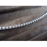 37 round cut brilliant diamonds set in square cases for this classic tennis bracelet. A total of 2.2