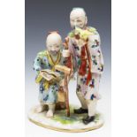 ANTIQUE CONTINENTAL PORCELAIN FIGURE OF TWO CHINESE ELDERS 19TH C.