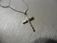 Pre-owned diamond cross pendant set with baguette cut diamonds of H/I colour. All the diamonds are