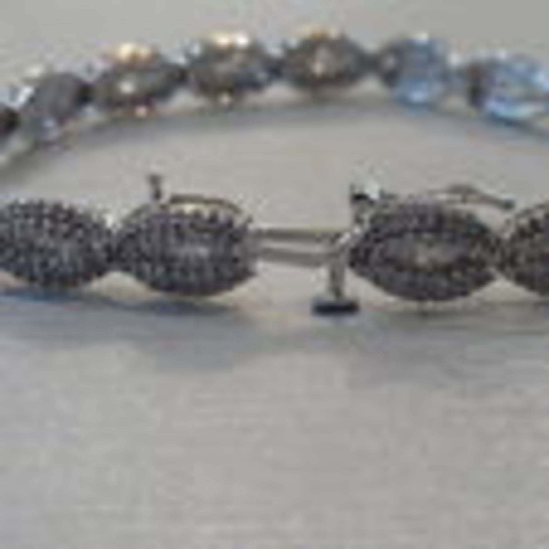 Brand new 10ct white gold fancy diamond bracelet set with oval sections of small baguette cut - Image 4 of 4