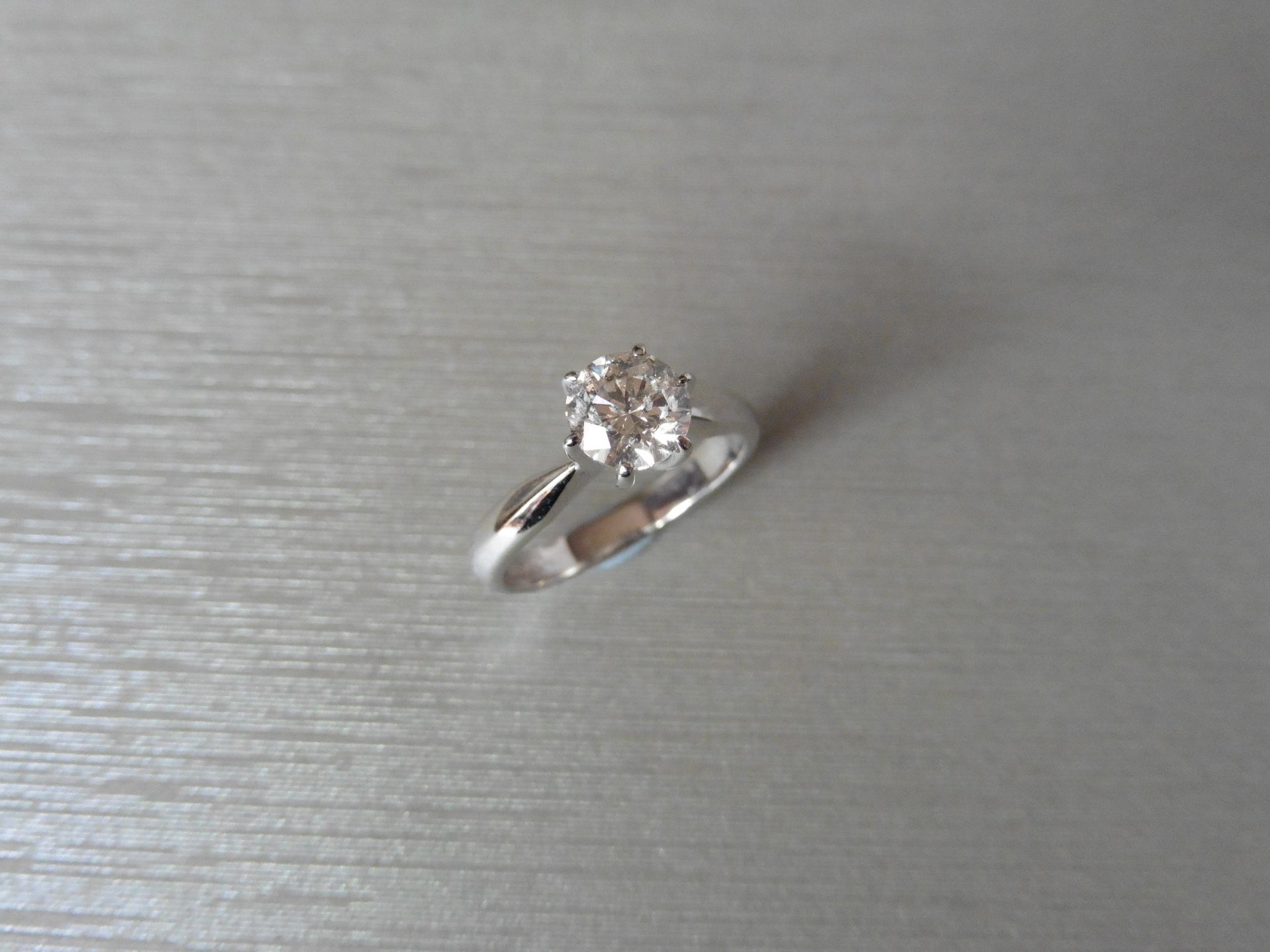 Brand new 18ct White gold diamond solitaire ring set with a 0.90ct brilliant cut diamond. This