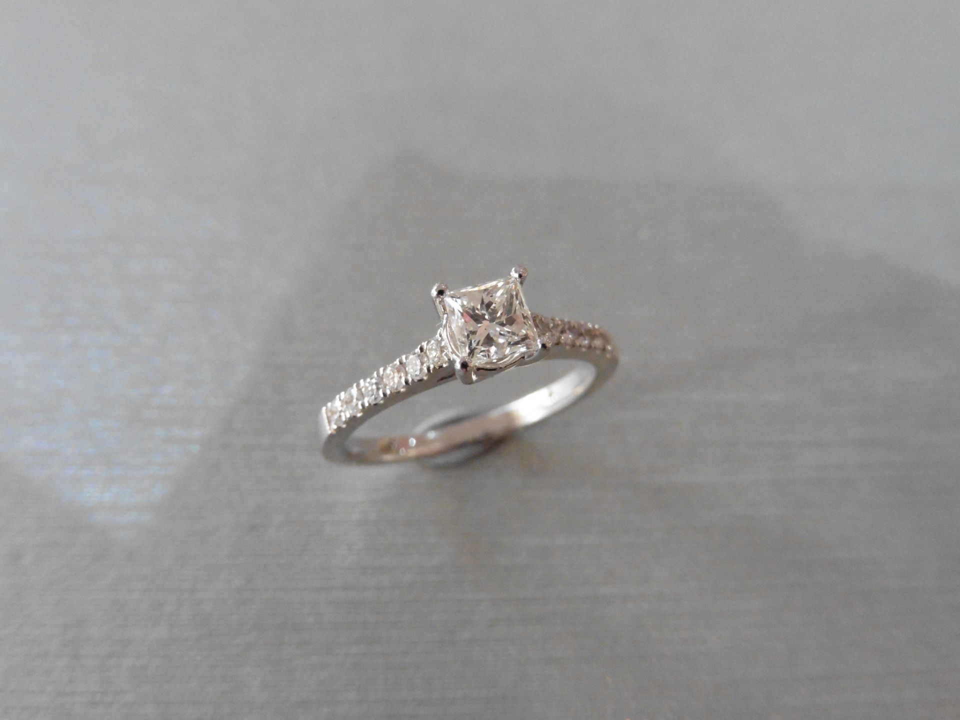 Brand new 18ct white gold diamond set solitaire ring set with a 0.50ct princess cut diamond, H