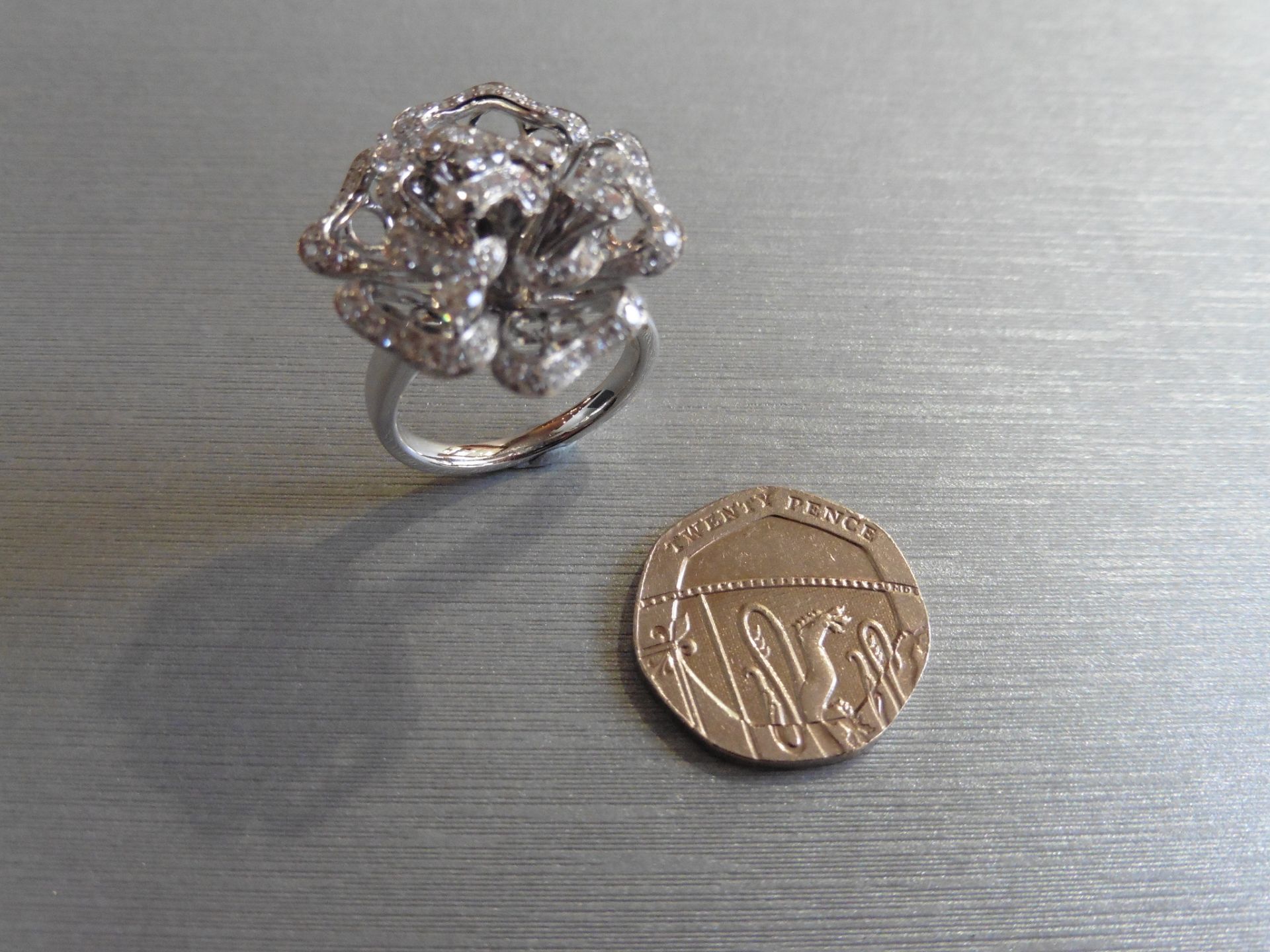 Brand new 18ct white gold high set fancy dress ring. Set in a flower design with small brilliant cut - Image 4 of 4