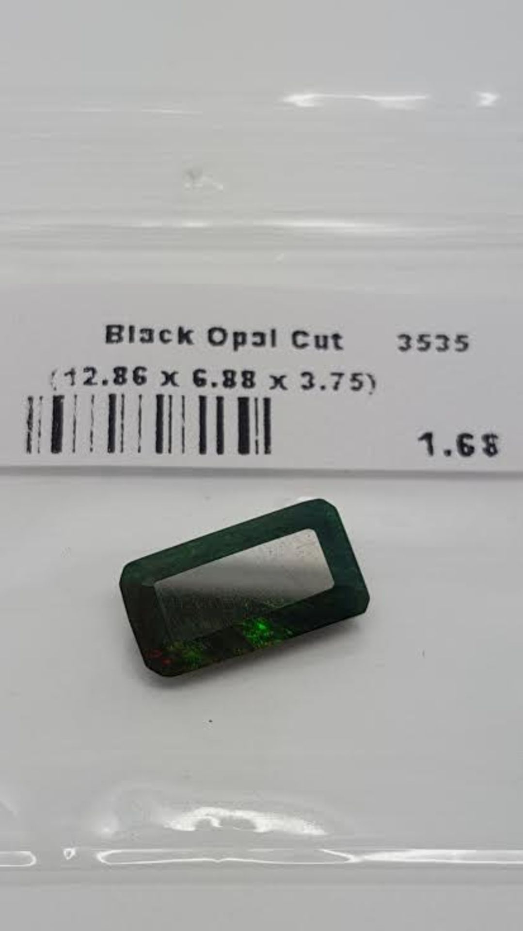 1.68 ct natural loose black opal with play of colour