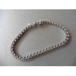 Brand new 18ct white gold tennis bracelet set with brilliant cut diamonds of H/I colour, si3