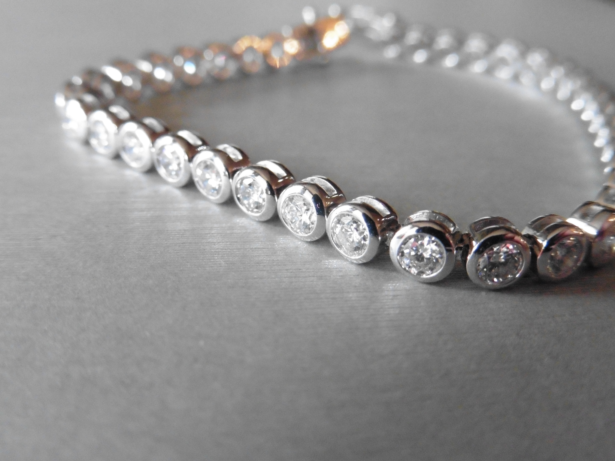 Brand new 18ct white gold diamond tennis style bracelet set with brilliant cut diamonds weighing 5ct