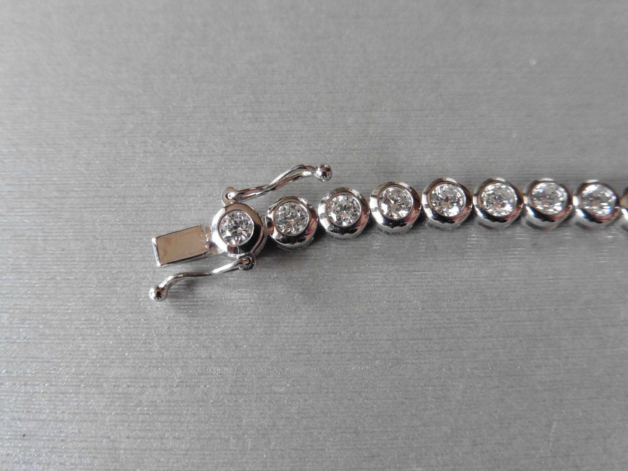 Brand new 18ct white gold diamond tennis style bracelet set with brilliant cut diamonds weighing 5ct - Image 3 of 4