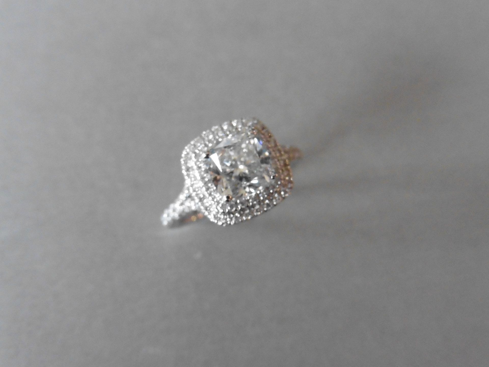 18ct white gold diamond set solitaire ring with a 1.81ct cushion cut diamond in the centre, F