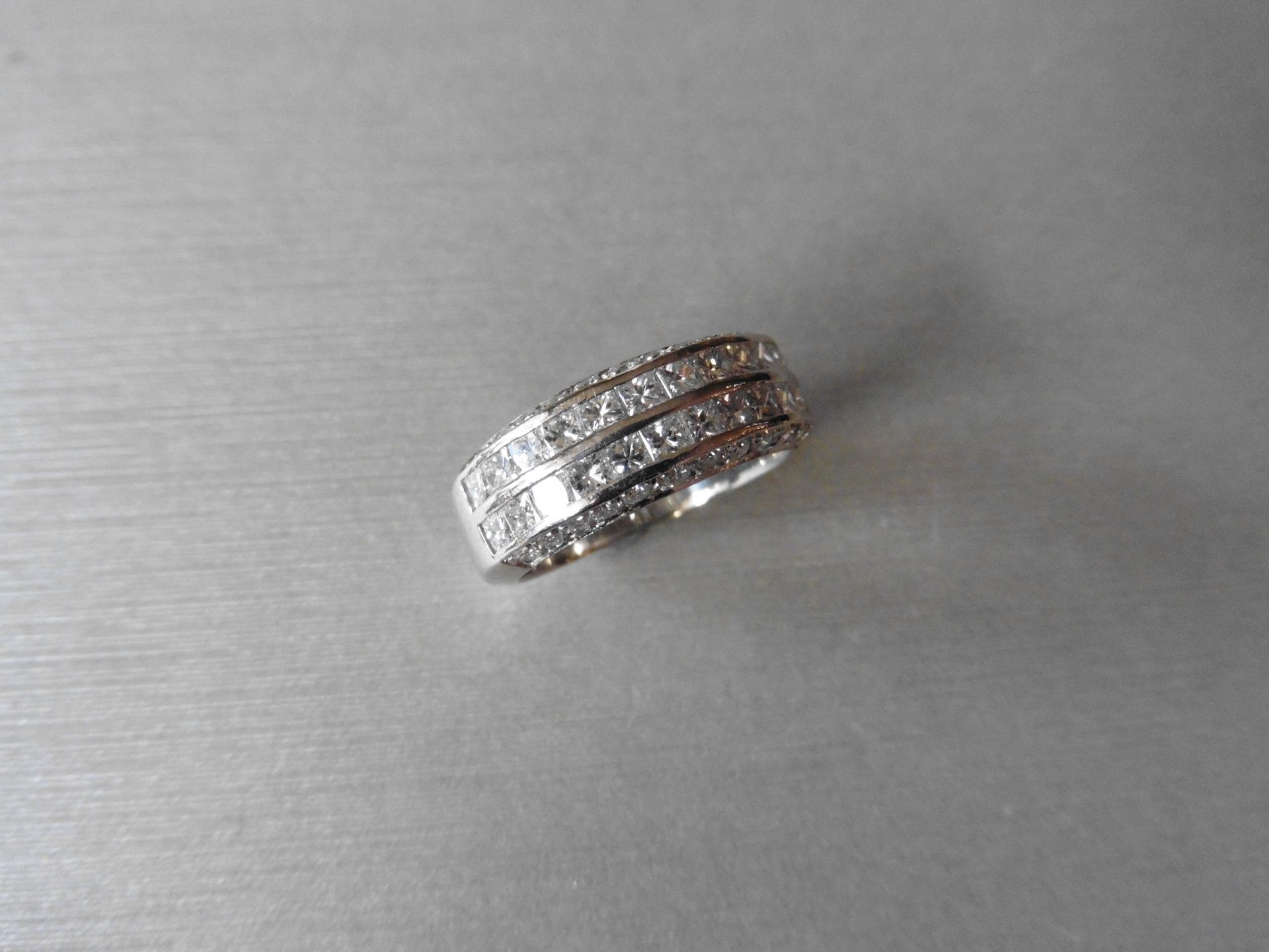 Platinum diamond band ring set with 2 rows of 24 princess cut diamonds, channel setting, H/I colour,