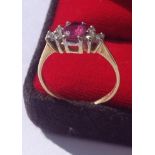 Antique gold ring with large ruby and 6 diamonds