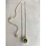 STUNNING STERLING SILVER (STAMPED 925) NECKLACE, ROUND PENDANT SET WITH GREEN STONES TO FORM A