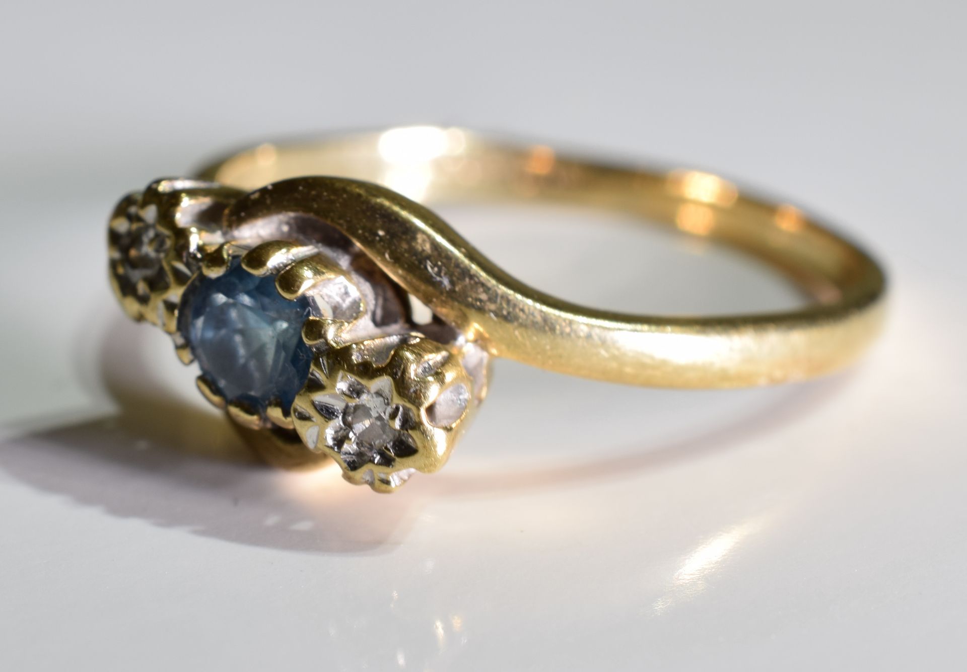 A 9ct Gold Sapphire and Diamond trilogy twist ring, - Image 3 of 3