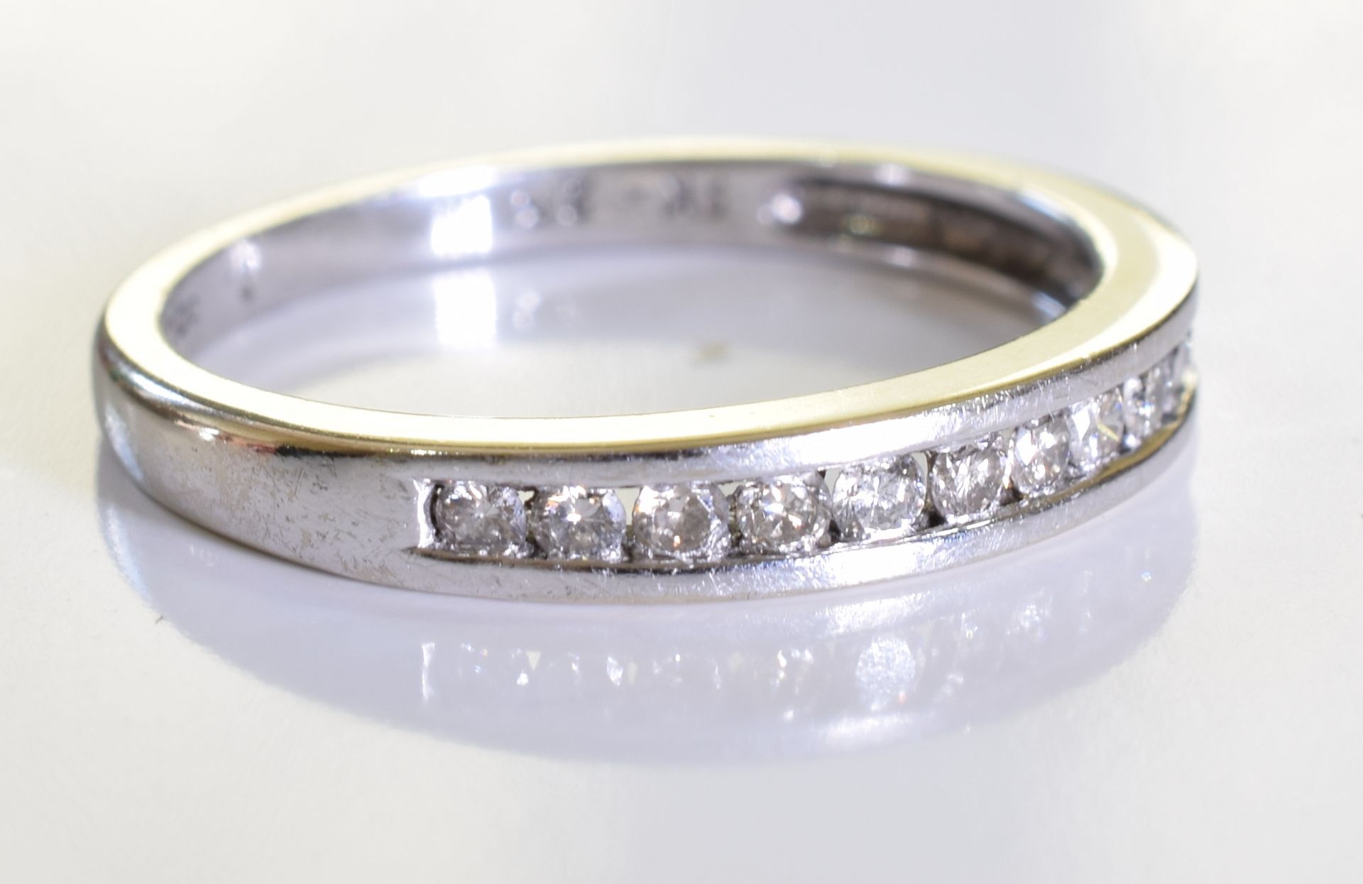 An 18ct gold diamond half-circle eternity ring. designed as a brilliant-cut diamond line, to the - Image 3 of 4